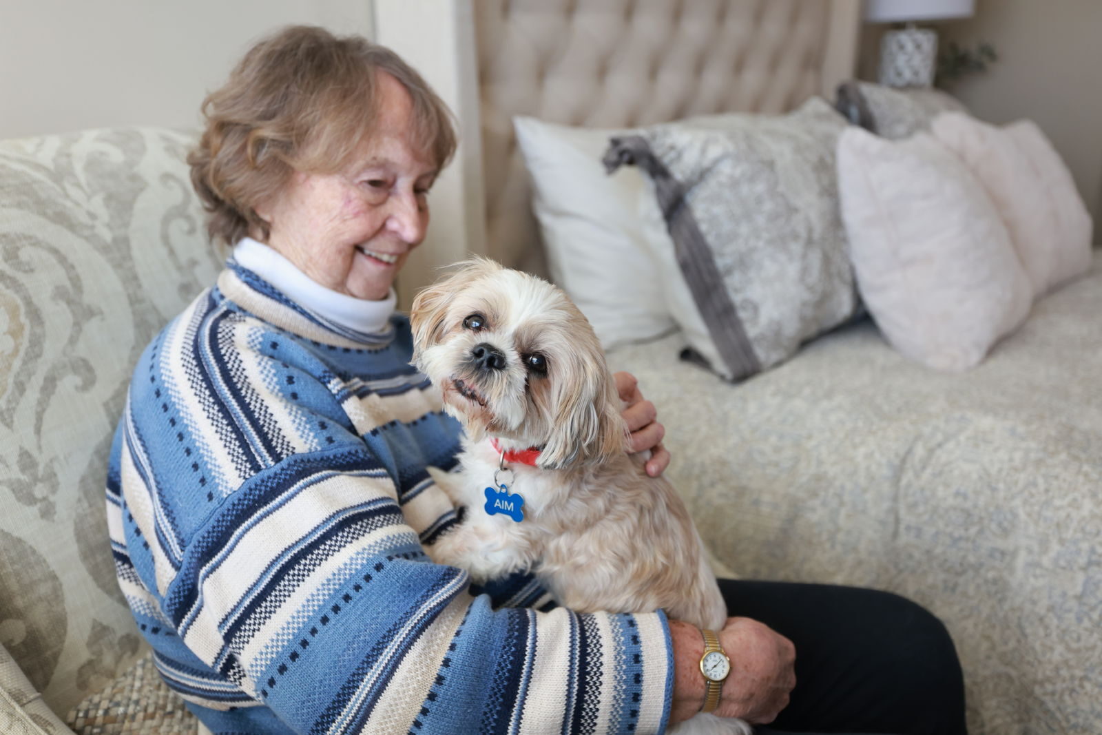 Resident with pet in apartment at The KentRidge Senior Living in Kent, OH