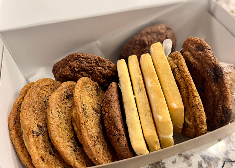 A box full of assorted cookies from a local business.